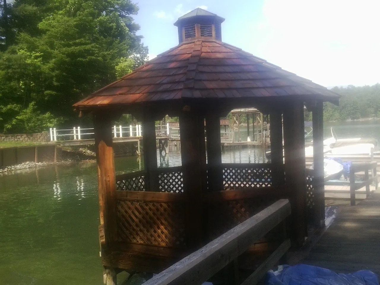 Cedar shake gazebo roof rebuilt on a lake dock in Princeton